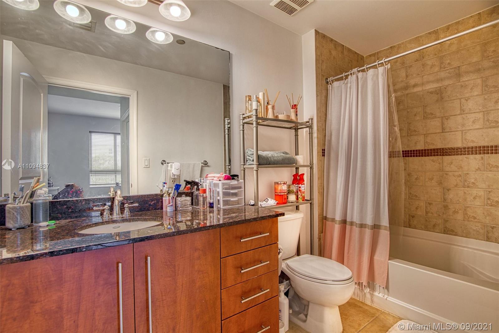 7355 Southwest 89th Street, Unit 425N Miami, FL 33156 - Photo 17 of 22 a bathroom with a sink toilet and shower
