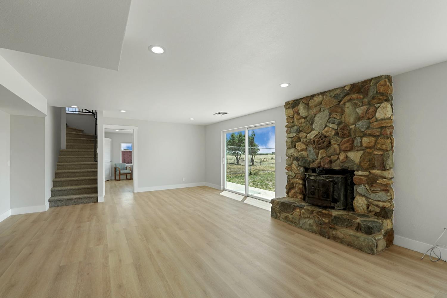 2650 West Twitchell Island Road Rio Vista, CA 94571 - Photo 45 of 60 a view of empty room with wooden floor and fireplace