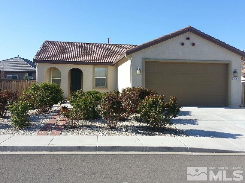 440 Pesaro Way Reno, NV 89521 - Photo 1 of 1 a front view of a house with a yard