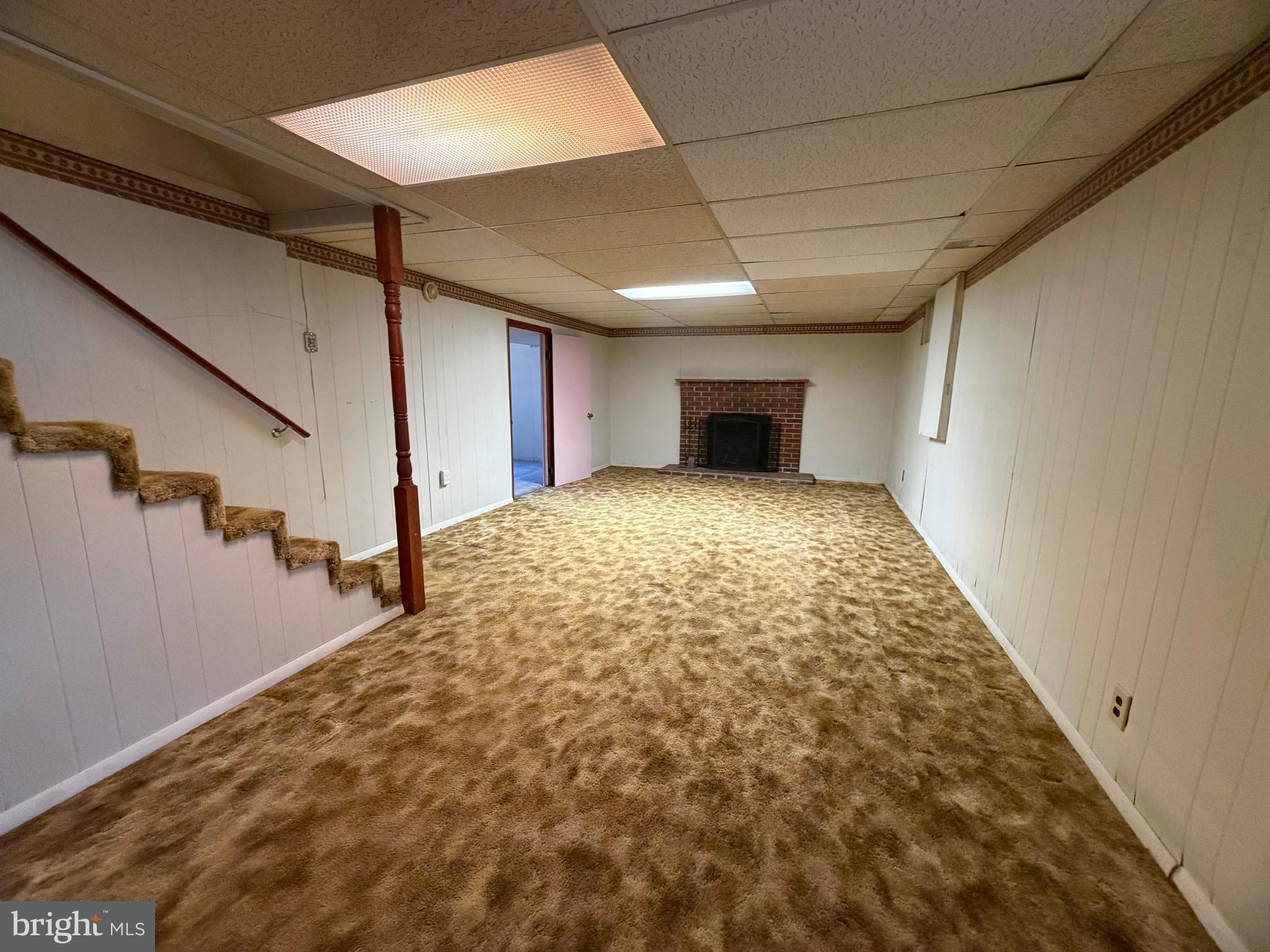 7819 McLean Street Manassas, VA 20111 - Photo 17 of 27 Basement recreation room with fireplace.
