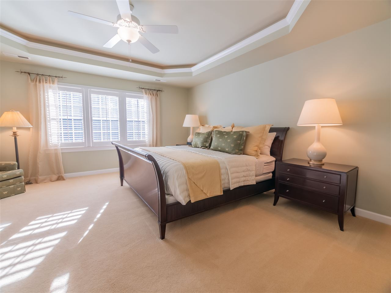 4016 White Chapel Way Raleigh, NC 27615 - Photo 15 of 30 The master bedroom features a tray ceiling with recessed lighting, custom shutters, updated ceiling fan and his & her walk-in closets.