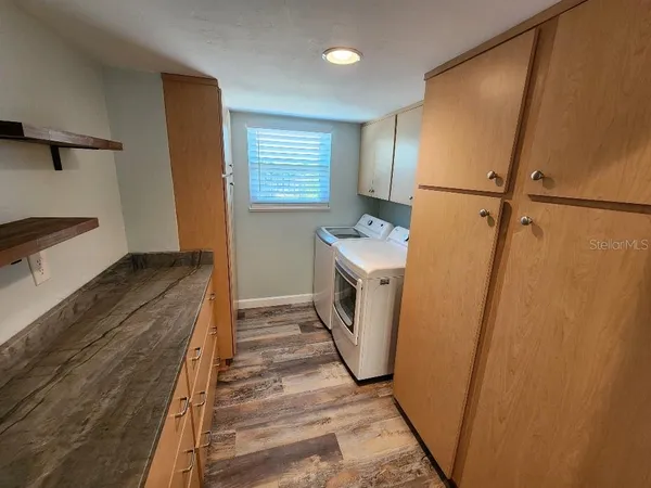 a view of a storage & utility room with washer and dryer