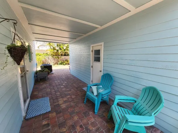 a view of a porch with furniture