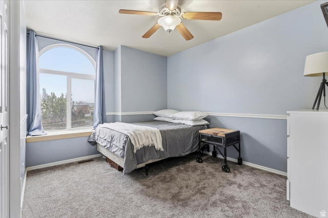 7975 Showcase Lane Sandy, UT 84094 - Photo 20 of 29 Bedroom #2 on second level with large window. Shown with full size bed.