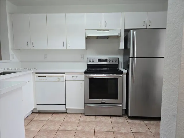 a view of an empty room with a fan