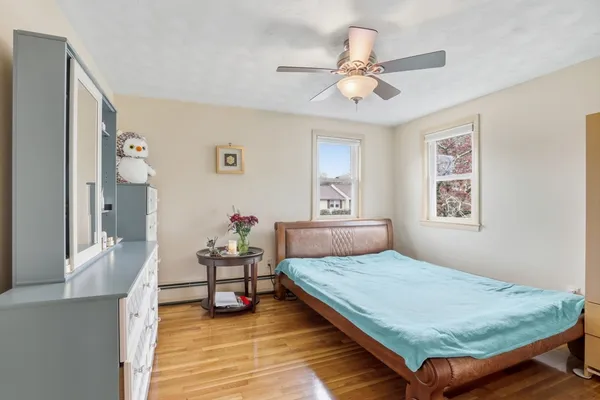 a bedroom with a bed and window