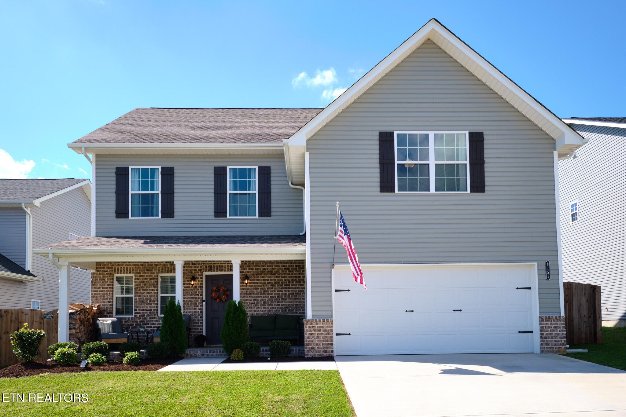 a view of house with yard