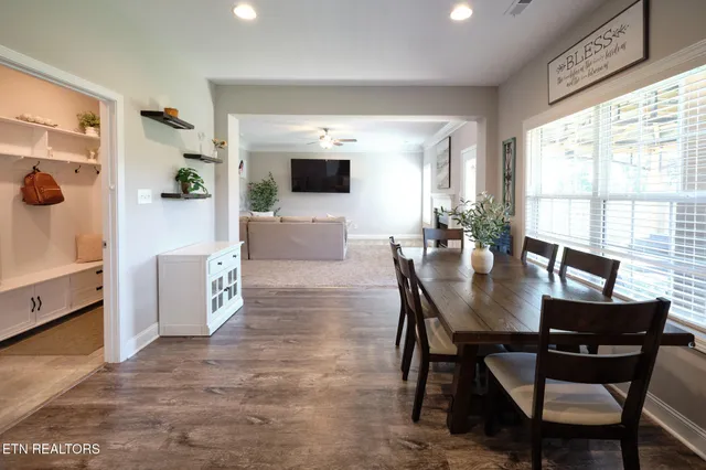 a view of a dining room with furniture and a window