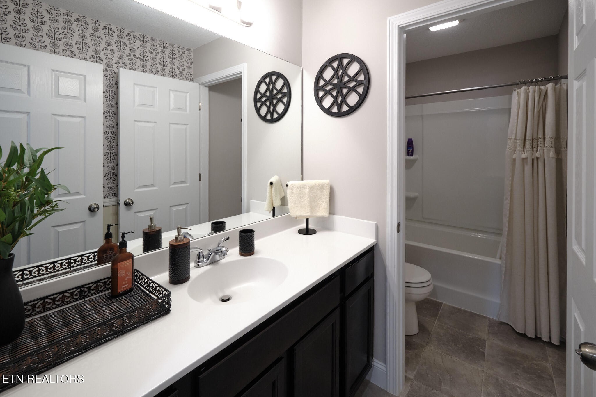 8155 Zenith Lane Powell, TN 37849 - Photo 23 of 45 a bathroom with a sink a mirror and a shower