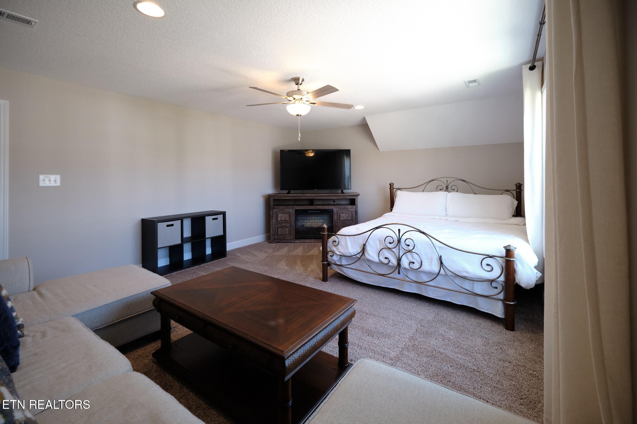 8155 Zenith Lane Powell, TN 37849 - Photo 26 of 45 a bedroom with a bed and a tv on the dresser
