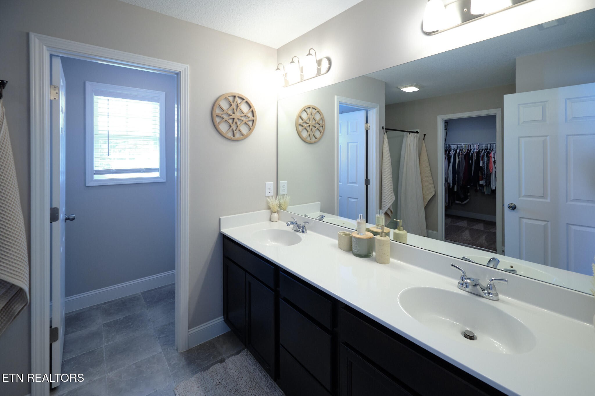 8155 Zenith Lane Powell, TN 37849 - Photo 34 of 45 a bathroom with a double vanity sink and a mirror