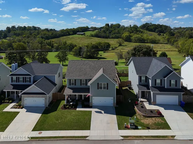 an aerial view of a house with a garden