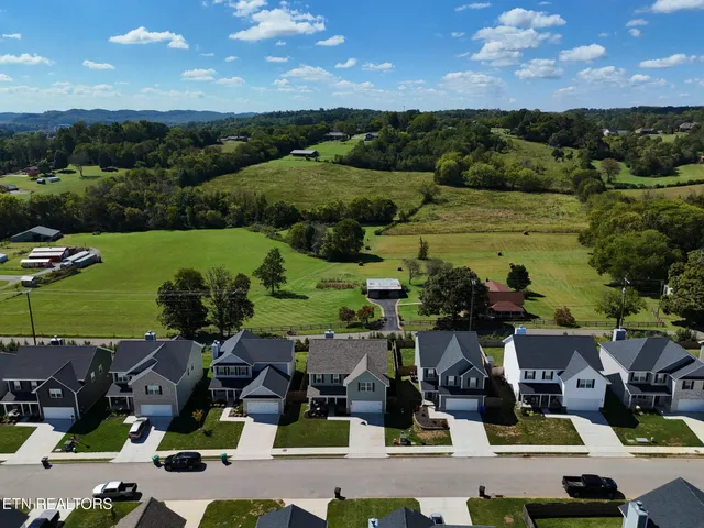 a view of multiple houses with outdoor space