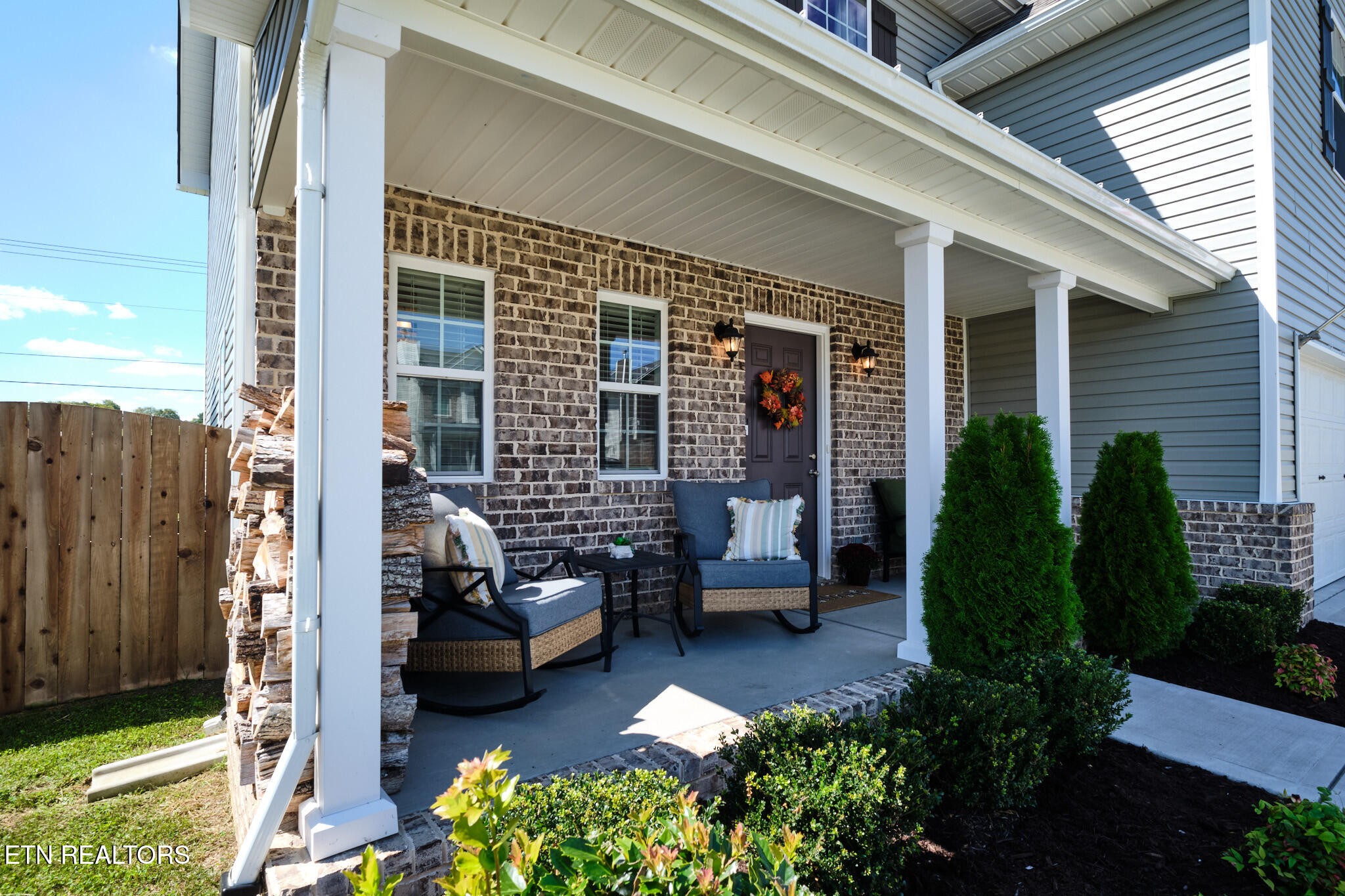 8155 Zenith Lane Powell, TN 37849 - Photo 4 of 45 a view of a patio with couches table and chairs and potted plants