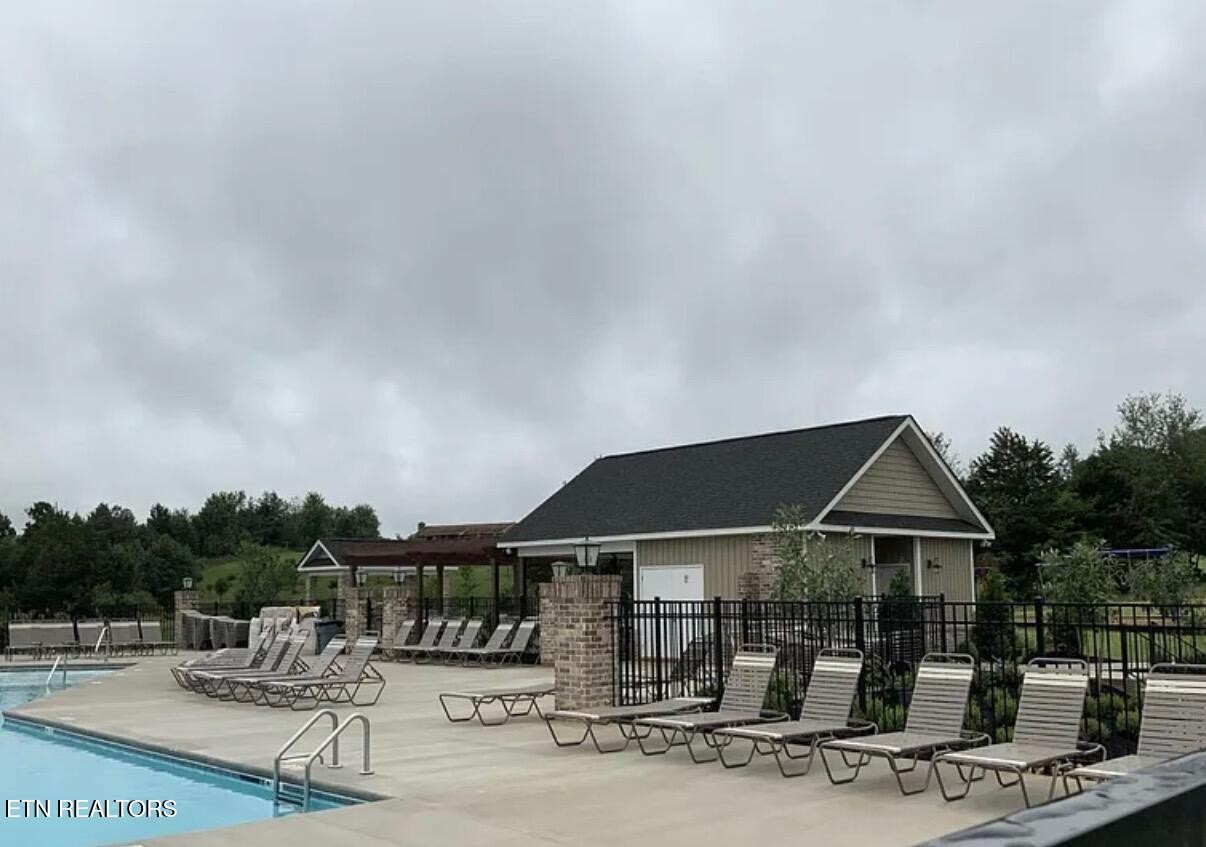 8155 Zenith Lane Powell, TN 37849 - Photo 43 of 45 a patio with a table and chairs