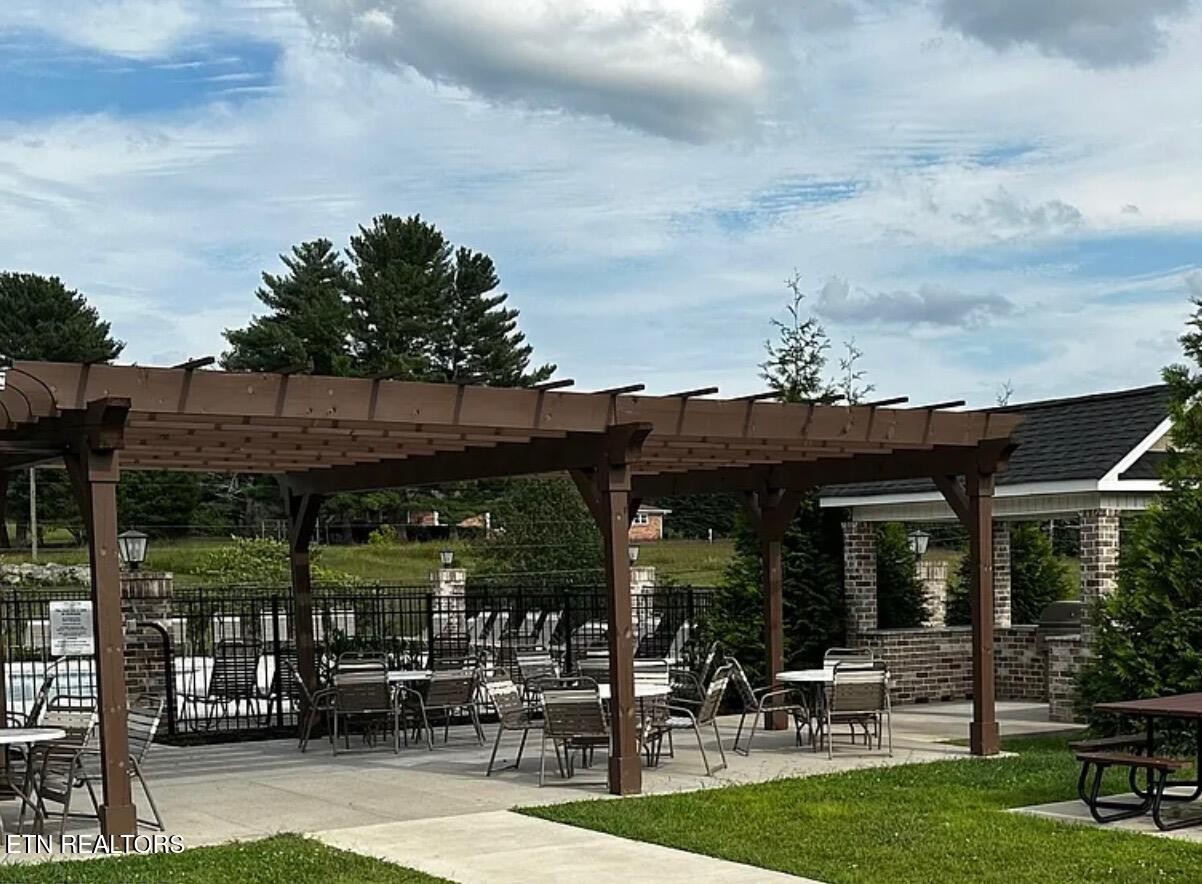 8155 Zenith Lane Powell, TN 37849 - Photo 44 of 45 a view of a chairs and table in patio with a yard