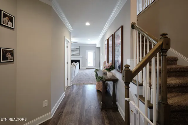 a view of entryway with wooden floor and stairs