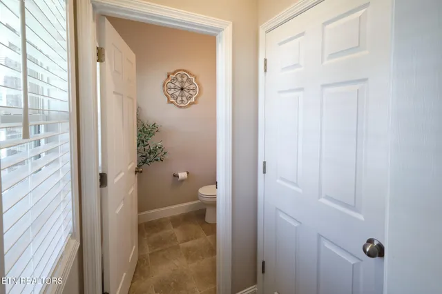 a bathroom with a granite countertop sink