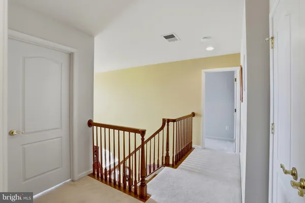 a view of a hallway with a door
