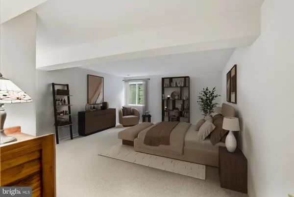 a bedroom with a bed and a couch