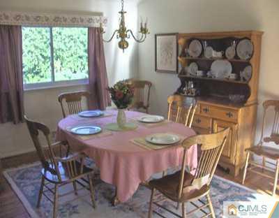 19 Atlantic Road Somerset, NJ 08873 - Photo 4 of 8 a view of a dining room with furniture window and outside view