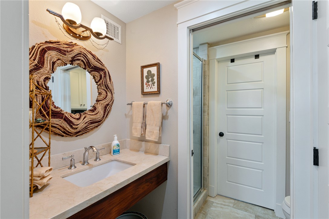 4046 Fm 1361 Somerville, TX 77879 - Photo 13 of 18 a bathroom with a sink vanity and a mirror