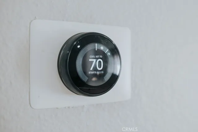 a kitchen with stainless steel appliances granite countertop a stove a sink dishwasher and a refrigerator with cabinets