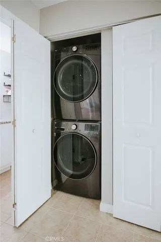 a utility room with closet dryer and washer