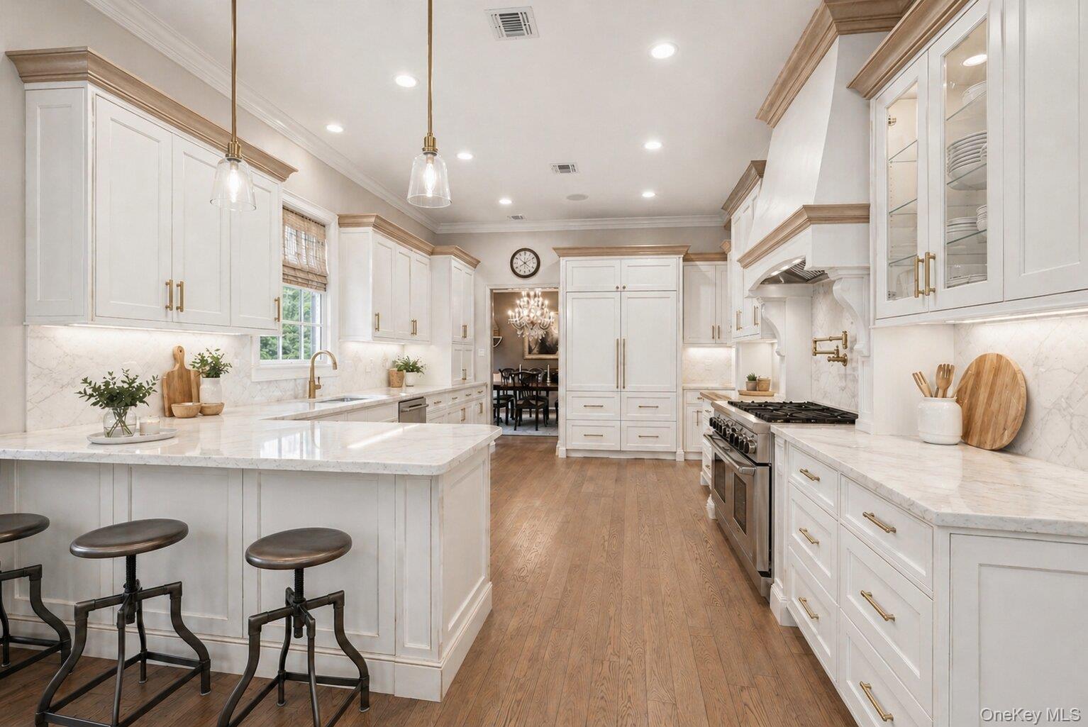 5 Mill Road Lloyd Harbor, NY 11743 - Photo 14 of 49 a kitchen with stainless steel appliances kitchen island granite countertop a sink and cabinets