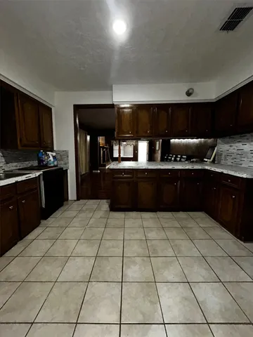 a kitchen with stainless steel appliances a sink and a counter top space