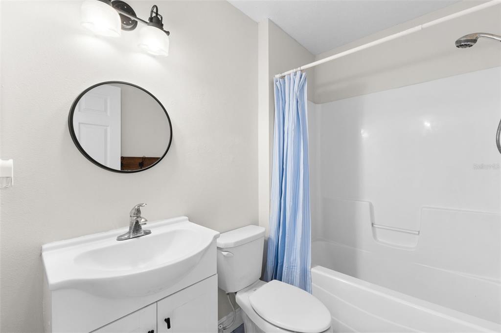 445 Horseshoe Loop Road Terra Ceia, FL 34250 - Photo 12 of 65 a bathroom with a toilet sink and a mirror