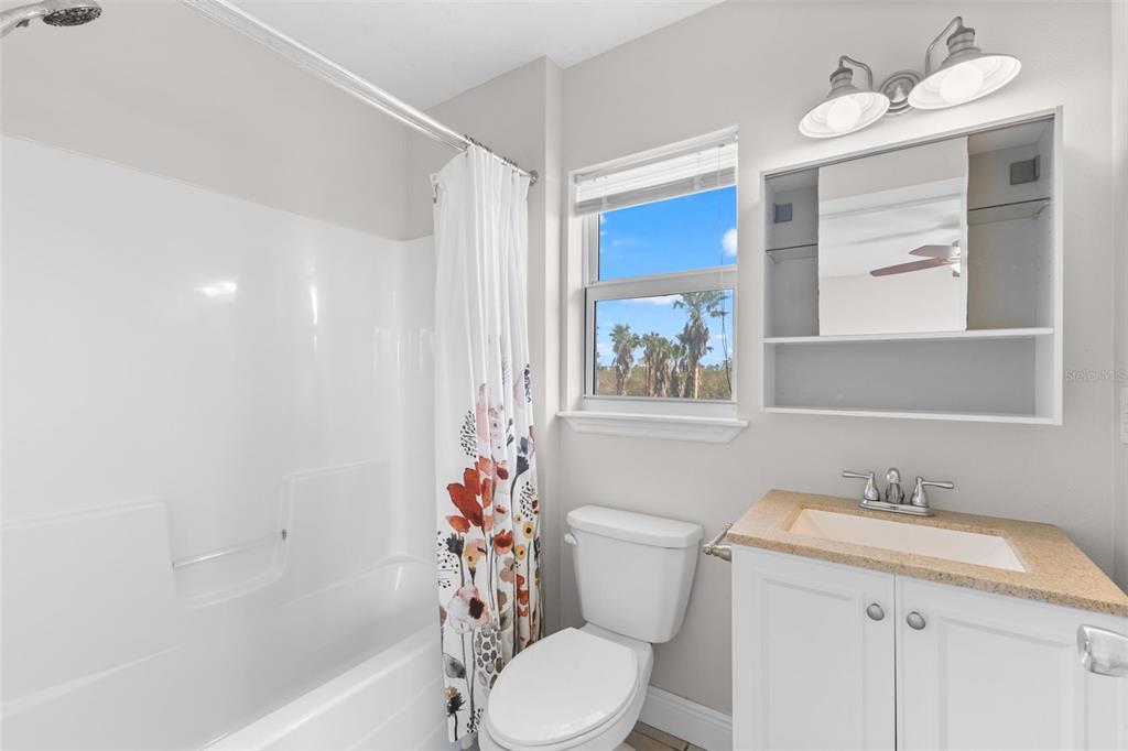 445 Horseshoe Loop Road Terra Ceia, FL 34250 - Photo 23 of 65 a bathroom with a sink toilet and shower