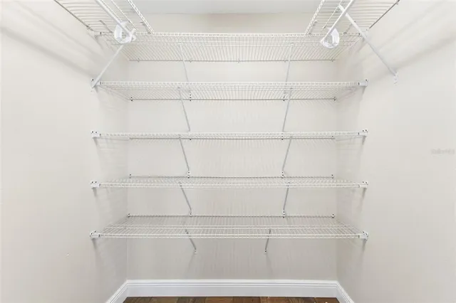 a view of a kitchen with furniture and a ceiling fan