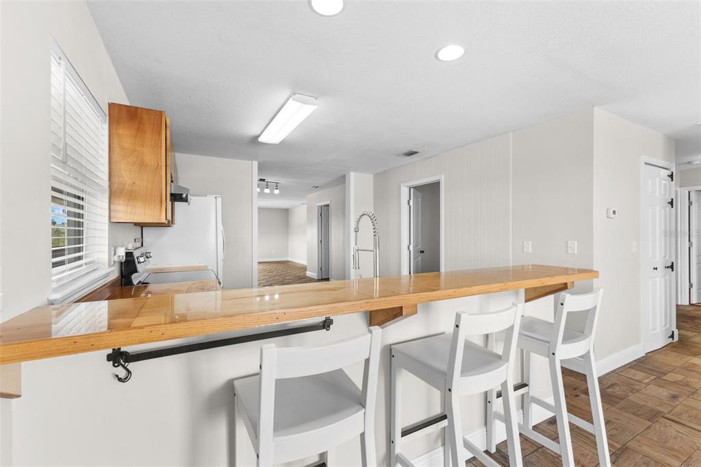 445 Horseshoe Loop Road Terra Ceia, FL 34250 - Photo 33 of 65 a room with a table chairs and a sink