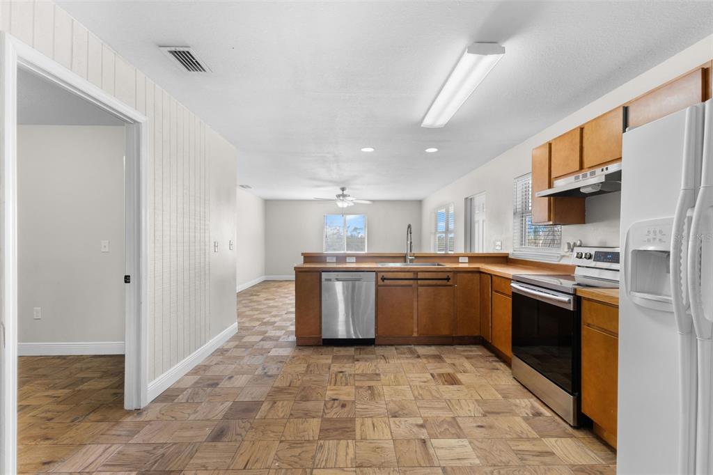 445 Horseshoe Loop Road Terra Ceia, FL 34250 - Photo 35 of 65 a kitchen with a sink cabinets and stainless steel appliances