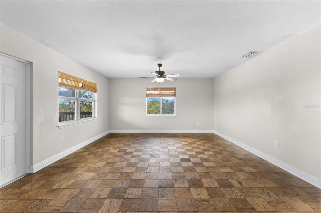 445 Horseshoe Loop Road Terra Ceia, FL 34250 - Photo 38 of 65 wooden floor in an empty room with a window