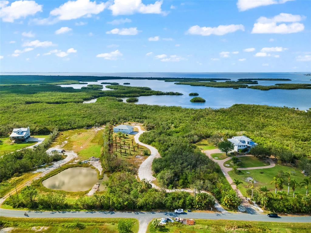 445 Horseshoe Loop Road Terra Ceia, FL 34250 - Photo 54 of 65 a view of an outdoor space and yard
