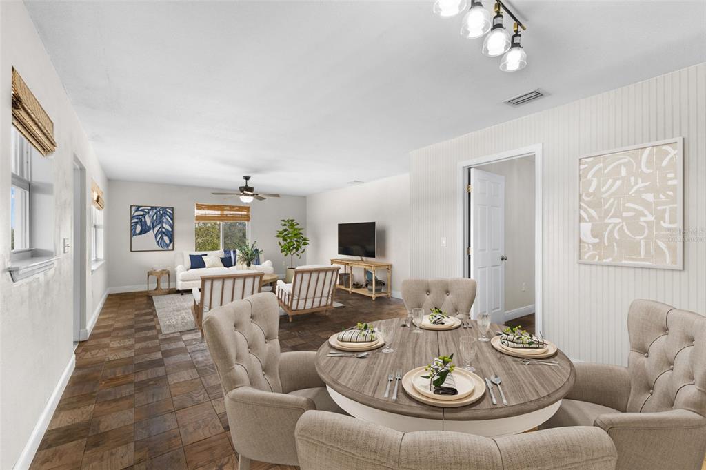 445 Horseshoe Loop Road Terra Ceia, FL 34250 - Photo 7 of 65 a living room with furniture and a chandelier