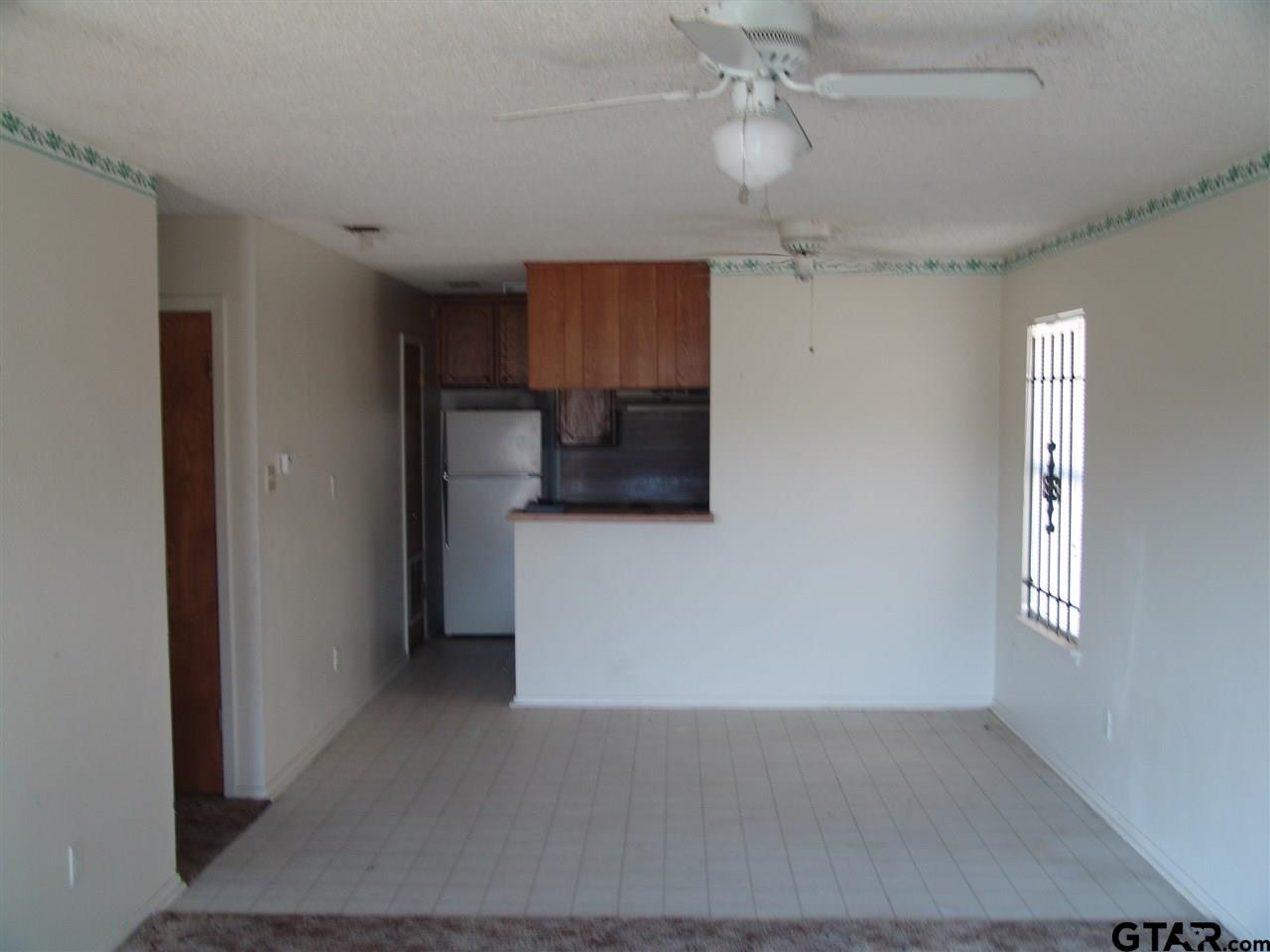 2809 West Shaw Street Tyler, TX 75701 - Photo 1 of 3 a view of a kitchen with a sink and a refrigerator