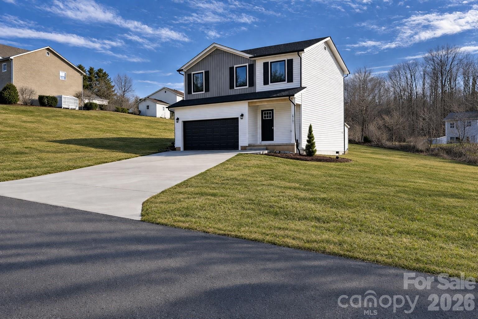 2323 Merts Way, Unit 1 Hudson, NC 28638 - Photo 1 of 15 a view of a house with a yard