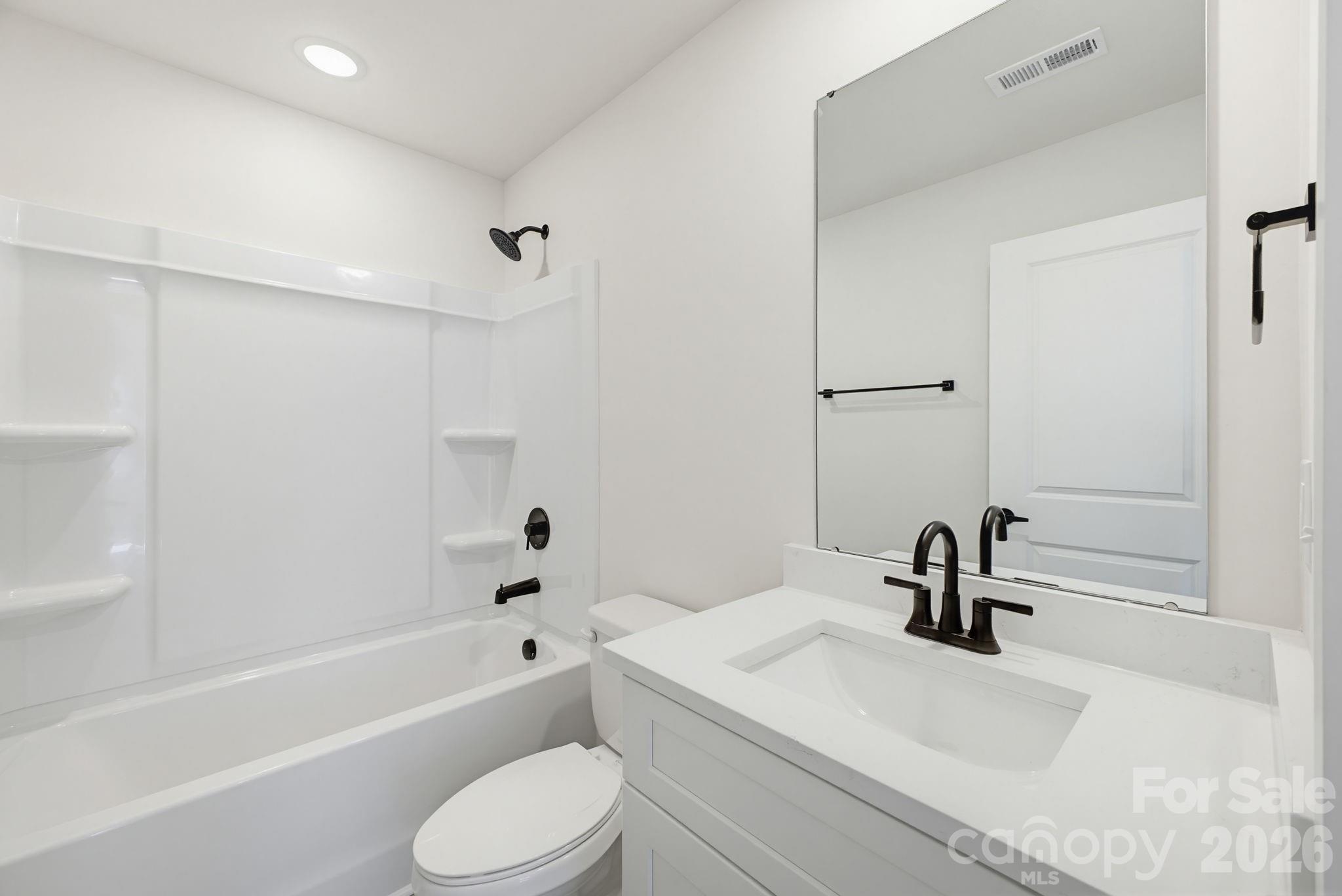2323 Merts Way, Unit 1 Hudson, NC 28638 - Photo 14 of 15 a bathroom with a sink a toilet and a bathtub