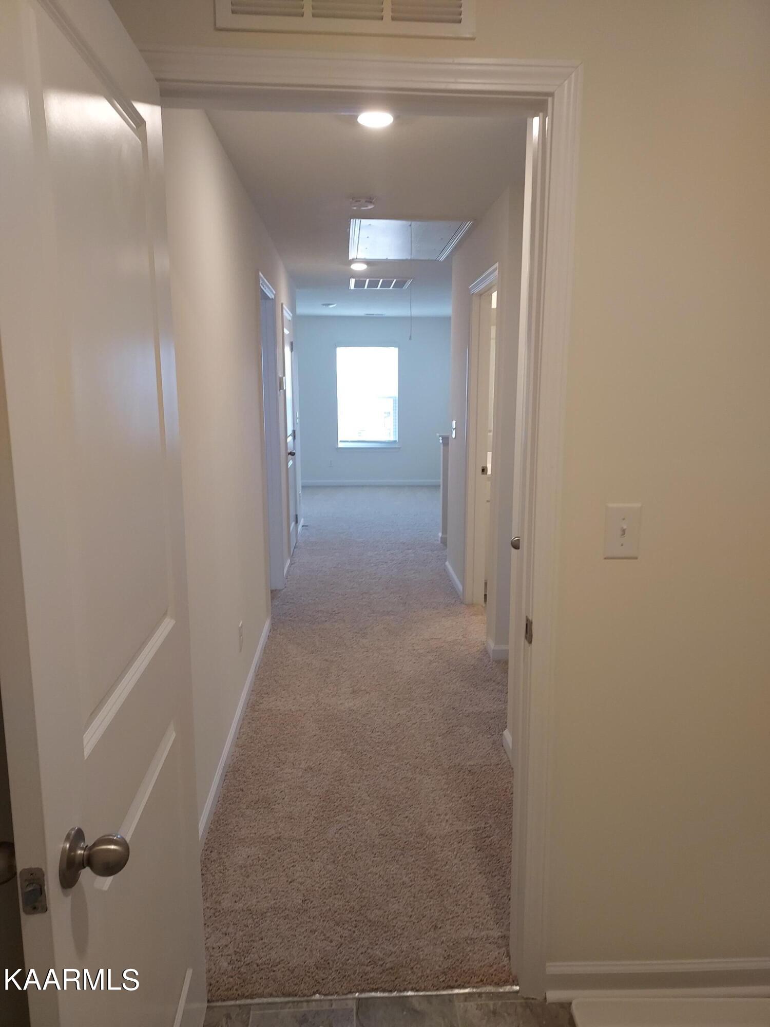 139 Ibis Loop Oak Ridge, TN 37830 - Photo 36 of 42 Hallway from Laundry to Sitting Area