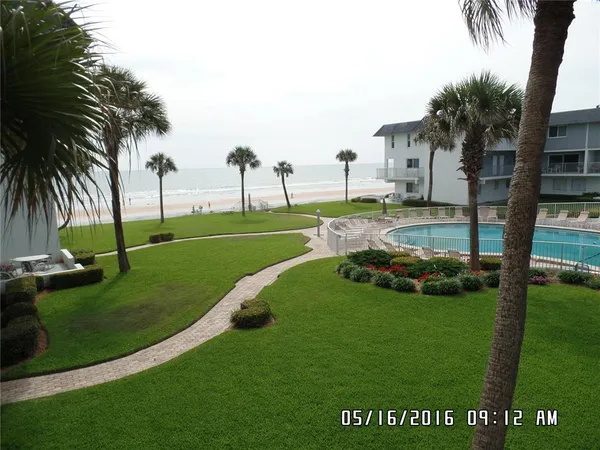 a view of a park with palm trees