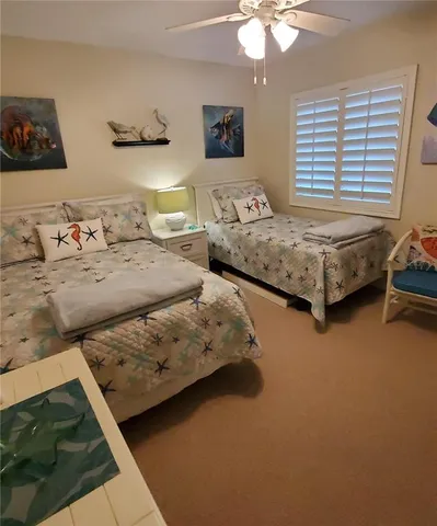 a bedroom with bed and window