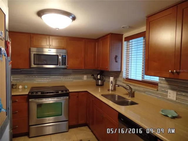 a kitchen with a stove and a sink
