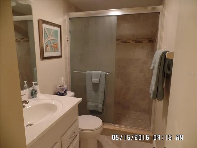 a bathroom with a shower and a toilet