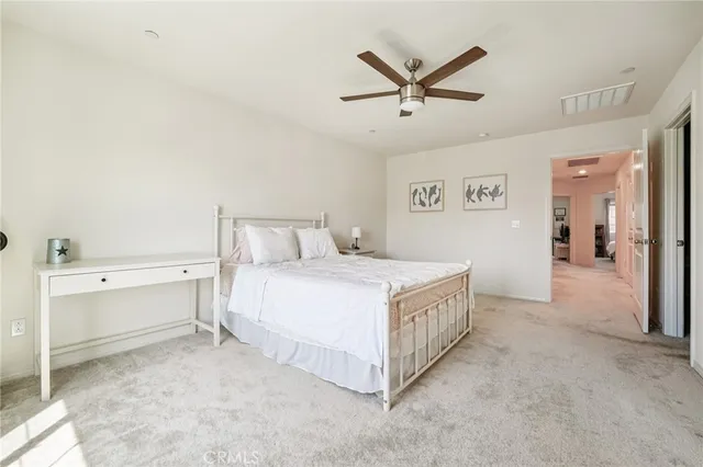 a bedroom with a bed and cabinets