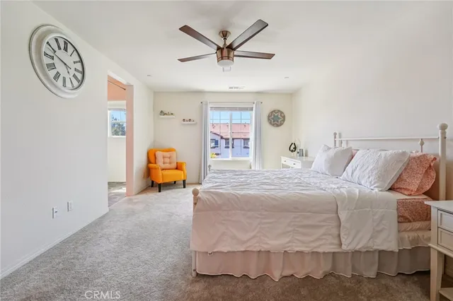 a bedroom with a bed and window