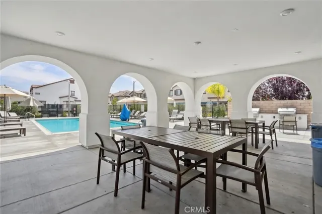 a view of a dining room with furniture and a potted plant