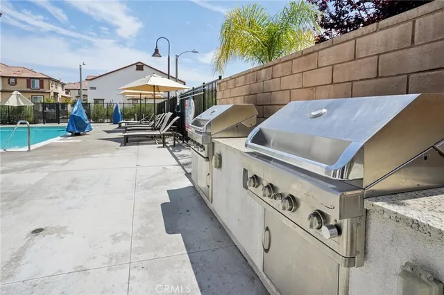 a view of a patio with chairs and a table